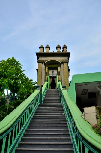 Keramat Habib Noh, located at 37 Palmer Road, is the largest and most highly regarded Muslim place of worship in Singapore with pilgrims visiting it from as far as China. The mausoleum sits on top of a flight of 49 steps. The long flight of steps is protected by yellow and green railings on both sides, and lined with potted plants. Yellow is the colour of holiness and green that of paradise. The steps lead to a building that houses the maqam - grave-  of Habib Noh. The entrance of the building is adorned with yellow curtains and green tie-backs. It leads into an inner room where the maqam lay.