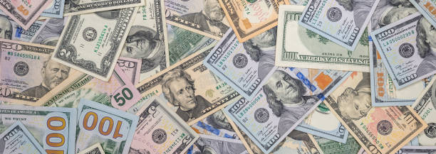 Background of different paper dollar bills. Saving concept