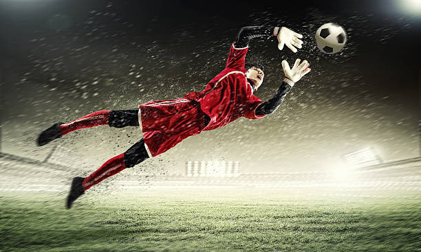 istock Goalkeeper catches the ball 178599328