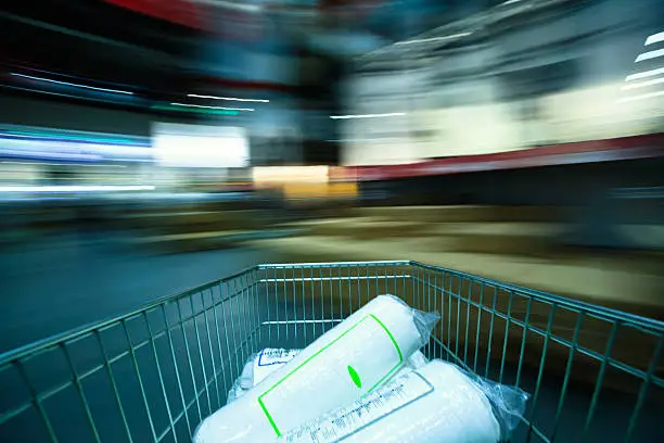 Motion-blurred of a moving shopping cart, shot with a slow shutter.