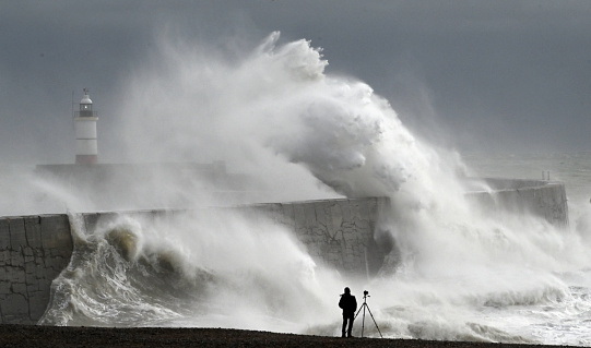 Dangerous powerful storm surge wave, dark and fearful provoking scene