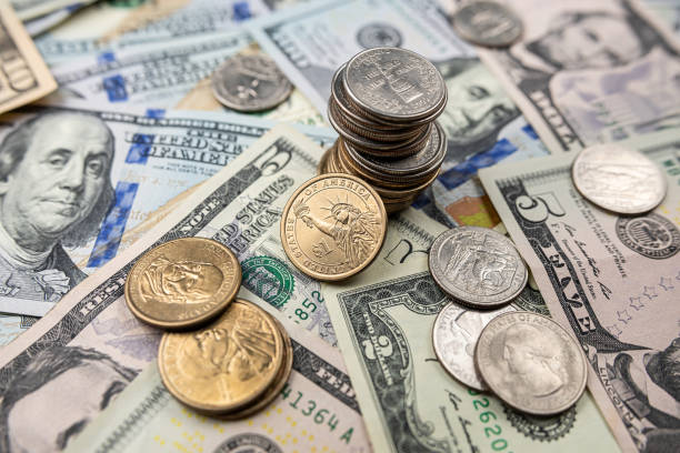 istock American money paper bills with coin cent 1786002730