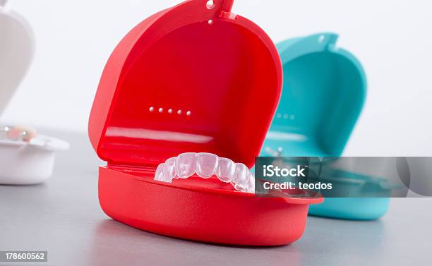 Red And Blue Box With Transparent Bleach Retainer Stock Photo - Download Image Now - Dental Aligner, Transparent, Dental Health