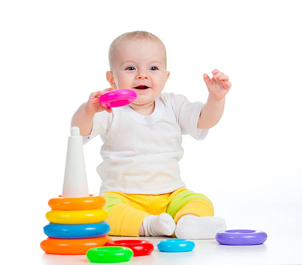 istock smiling baby playing with toy isolated on white 178600601