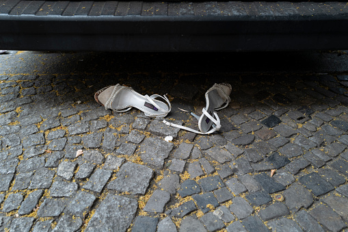 A pair or women's slingback shoes abandoned under a van in Berlin.