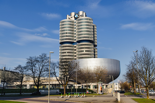 Munich, Germany - April 05, 2023: modern buildings of the BMW Museum and the BMW Tower. BMW is a German multinational manufacturer of luxury vehicles