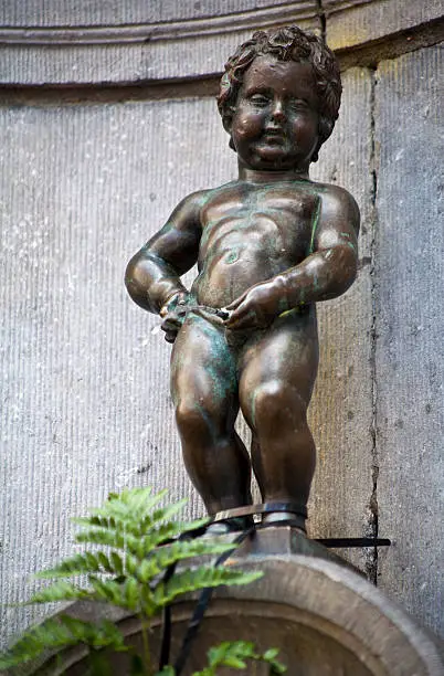 The famous Manneken Pis (Peeing Boy) landmark in Brussels, Belgium.