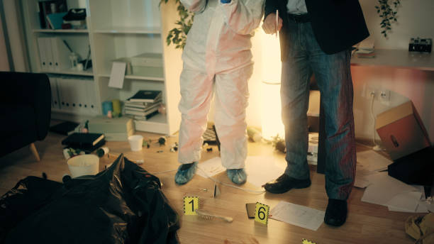 istock The detective and the forensic expert are discussing the crime scene while examining the evidence 1786035343