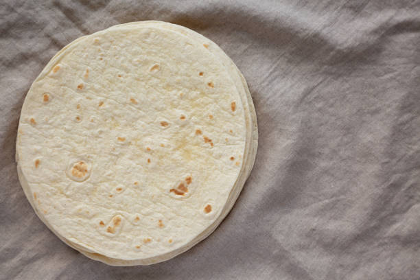 istock Homemade Mexican Corn Tortillas in a Stack, top view. Flat lay, overhead, from above. Space for text. 1786039765