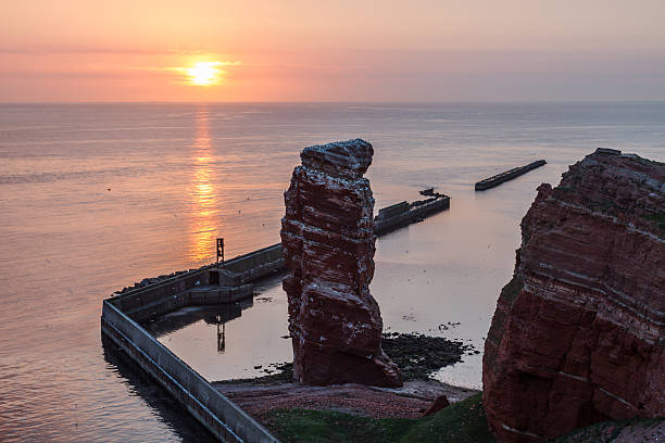 istock Sundown on Helgoland with Lange Anna and calm sea 178604257