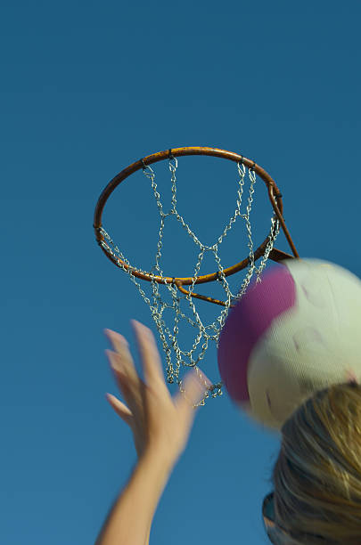 istock Girl shooting a netball goal 178604550