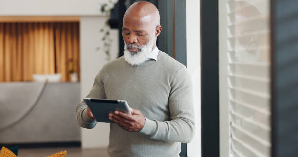 istock Business, internet and black man with a tablet, typing and connection with network, website info or professional. Mature person, employee or worker with technology, email notification or social media 1786048477