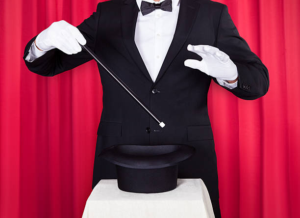 istock Young Magician In A Black Suit 178605053