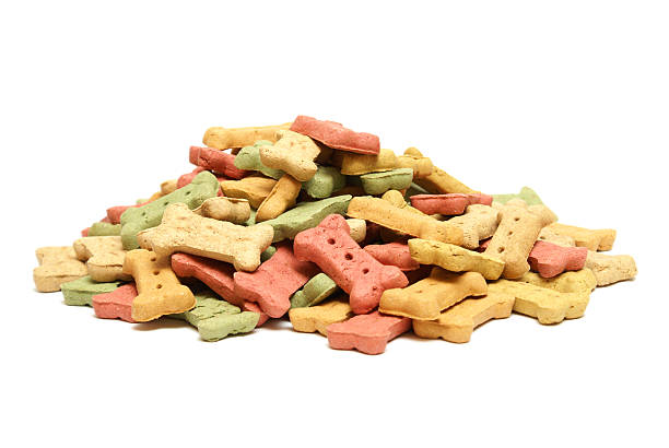 Dog Treats A variety of flavourful treats to reward mans best friend. dog biscuit photos stock pictures, royalty-free photos & images