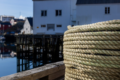 coiled rope at the quay in Reine harbour on the Lofoten Islands; Reine, Norway