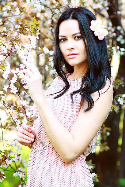 istock brunette woman in the park 178606255