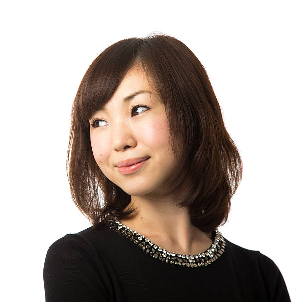 istock Asian Woman Smiling and Looking Over Her Shoulder 178606333