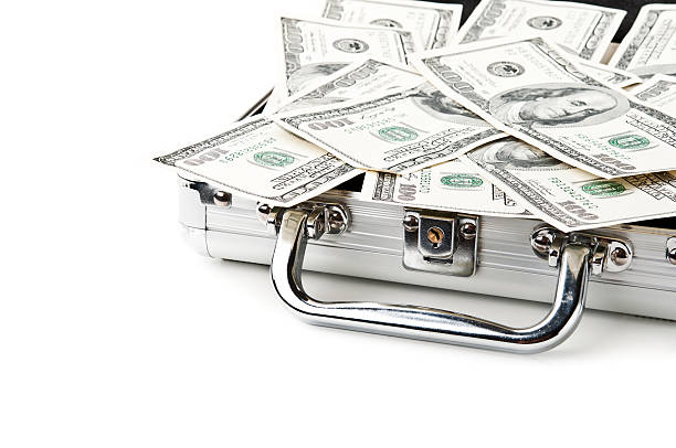 istock suitcase full of dollars 178607645