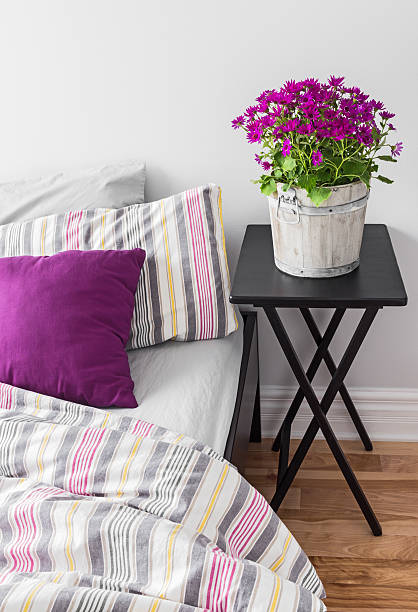 istock Purple flowers in a bright bedroom 178608340