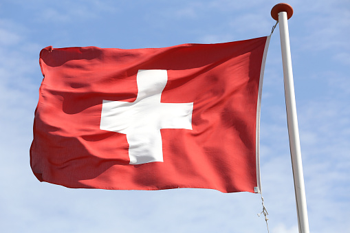 Swiss flag flying in the wind