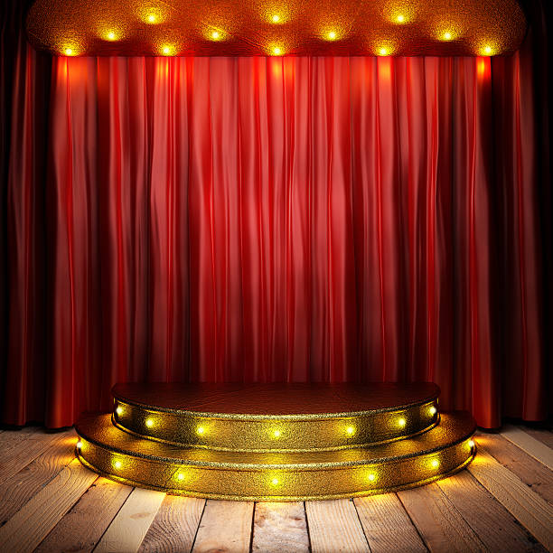istock Golden stage with red curtain illuminated by spotlights 178608899