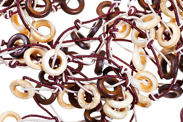 istock bone and wooden necklaces close up 178609054