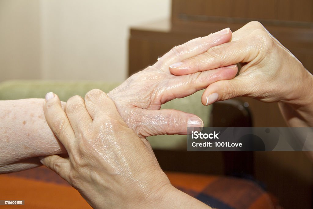 Physical Therapy for seniors Senior woman having physical therapy at home. 30-39 Years Stock Photo