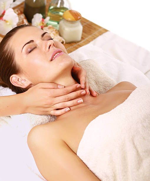 istock beautiful brunette woman taking head massage 178609216