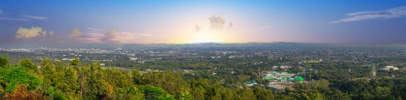 Panorama view of Chiangmai Chiang Mai city taken from Doi Suthep Mountains. Lovely views of the Old city at Sunset Sunrise lovely tropical mountains and beautiful nature in the foreground