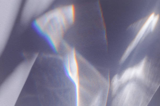 istock Sunlight background, abstract backdrop with light and shadow, glare and shine on paper texture, rainbow sun flare, blue violet color aesthetic image. Natural beams light, caustics effect 1786104228