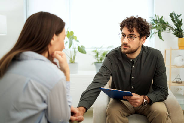 istock Therapist consoling patient at the office 1786105923