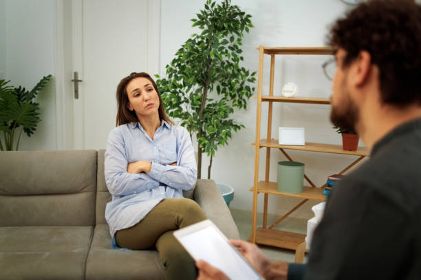 istock Young well dressed woman talking with therapist at the office 1786105963