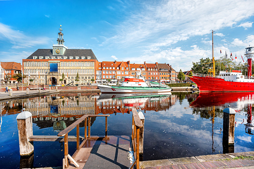 Harbor of Emden city with historic light vessel and sailship, Lower Saxony, Germany