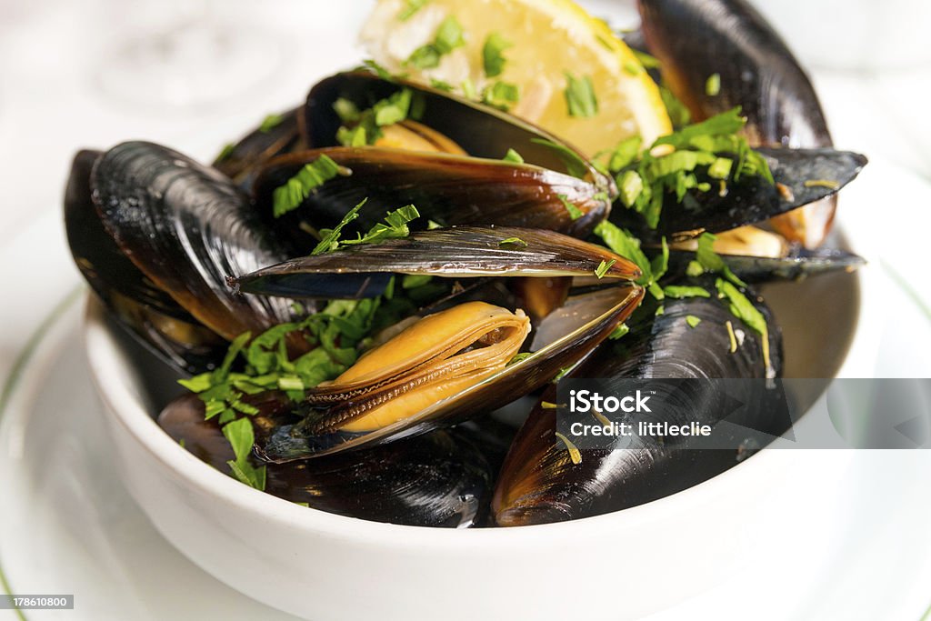 Mussel with white wine sauce on table http://farm4.static.flickr.com/3161/5758562880_0cd4838686_d.jpg Food Stock Photo