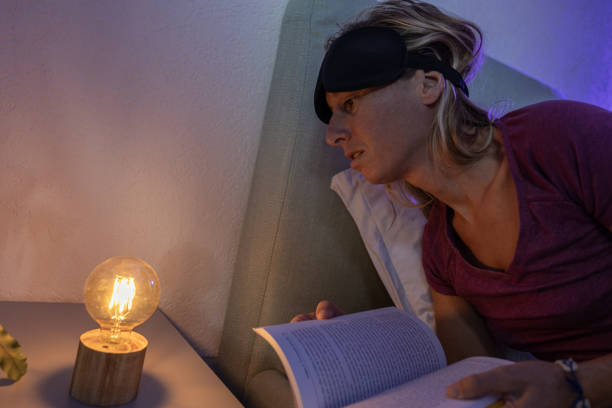istock Reading a book before sleep, female ready to go to sleep 1786108817