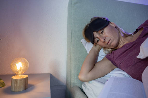 istock Reading a book before sleep, female ready to go to sleep 1786108824