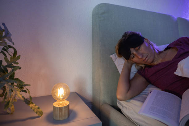 istock Reading a book before sleep, female ready to go to sleep 1786108826