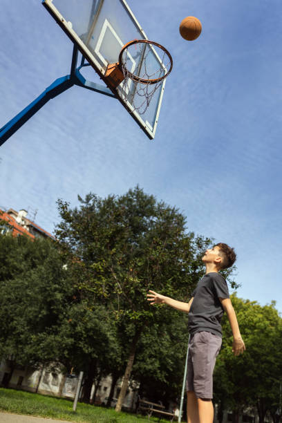 istock Cute boy plays basketball 1786109169