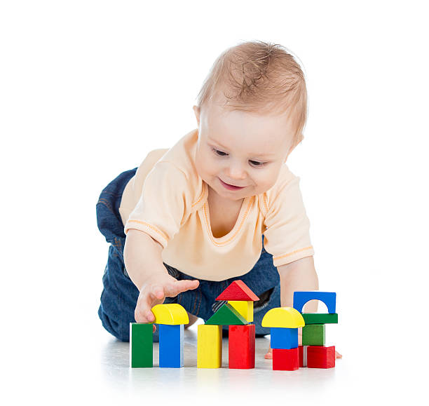 istock little child playing with building blocks 178611078