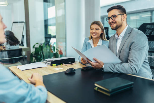 Human resource team talking to a candidate during a job interview in the office.