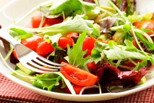 salad (arugula, iceberg, red beet) in a bowl