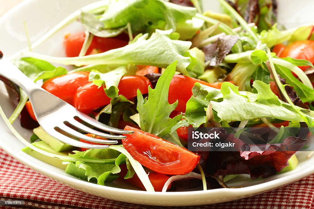 salad (arugula, iceberg, red beet) in a bowl salad (arugula, iceberg, red beet) in a bowl on the table Arugula Stock Photo