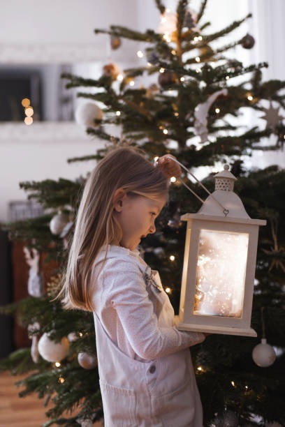 istock Girl holding a lantern with the lights 1786114652