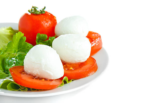 Mozarella cheese with tomato and salad stock photo