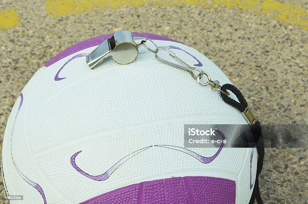 Netball and whistle on a court A netball and whistle on a court Australia Stock Photo