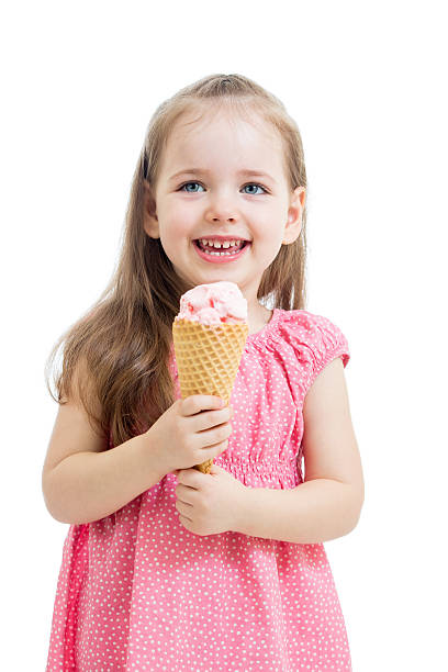 istock joyful kid girl eating ice cream over white background 178612818