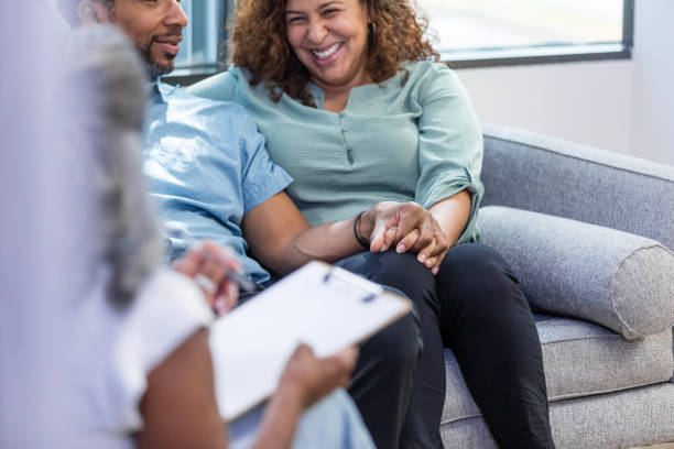 istock Woman laughs at husband's comment during therapy 1786128700
