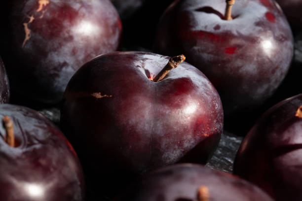 red plum on wood