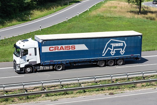 Engelskirchen, Germany - June 24, 2020: Renault truck with Craiss curtainside trailer on motorway