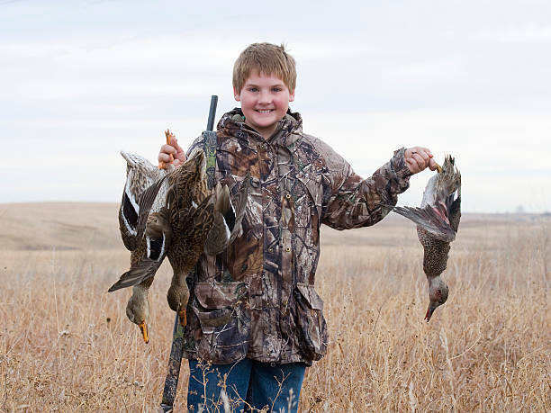 Boy Duck Hunting stock photo